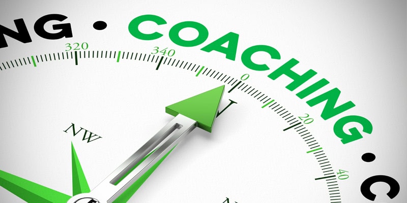 Erfolgsfaktoren im Kita-Coaching, Kompass mit dem Wort Coaching